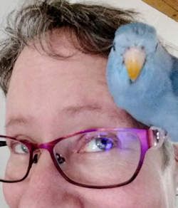 Andrea and her Parrotlet Delilah